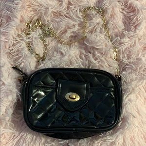 Ariana Grande black and gold chain purse